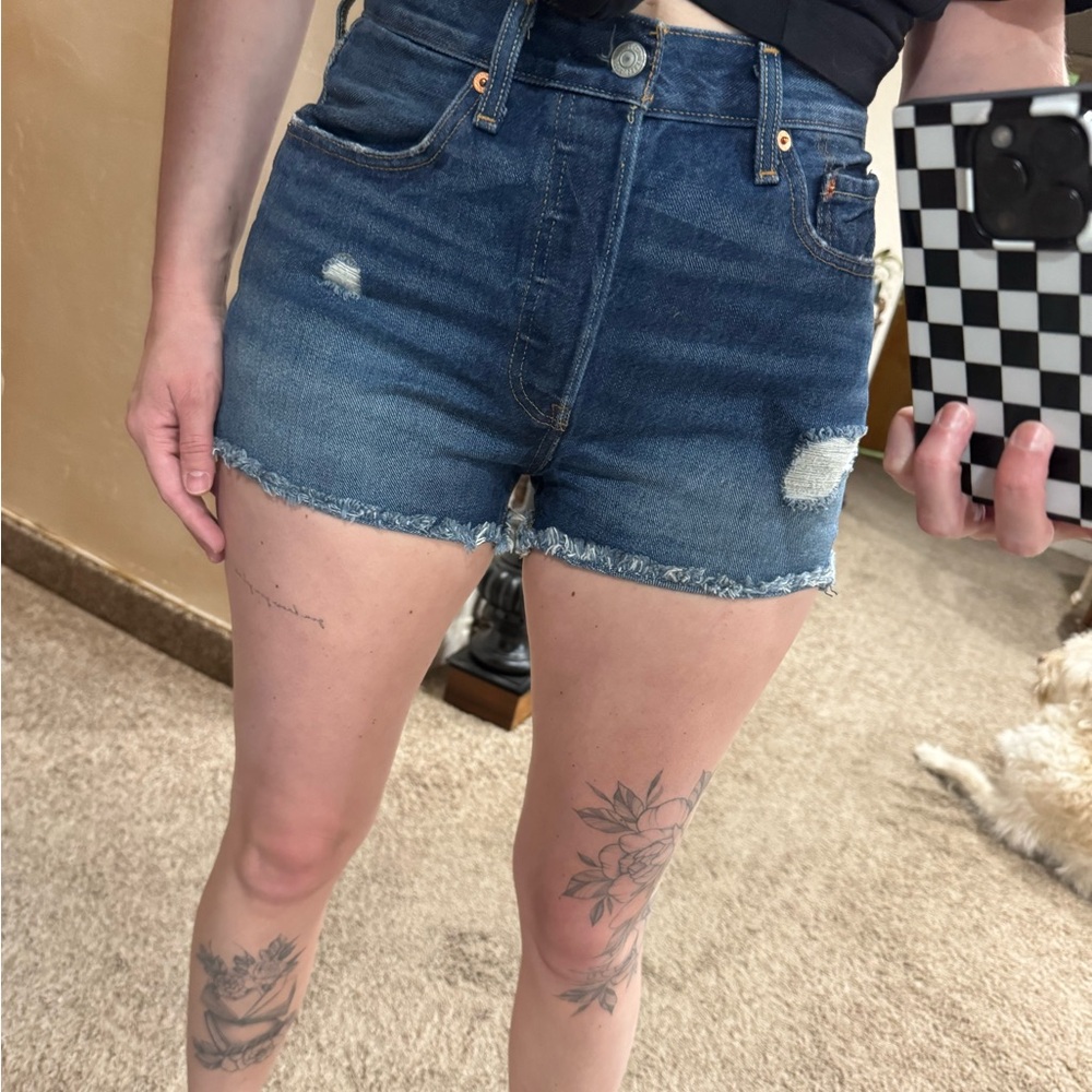 Levi's Blue Jean Shorts with Distressed Details and Raw Hem
